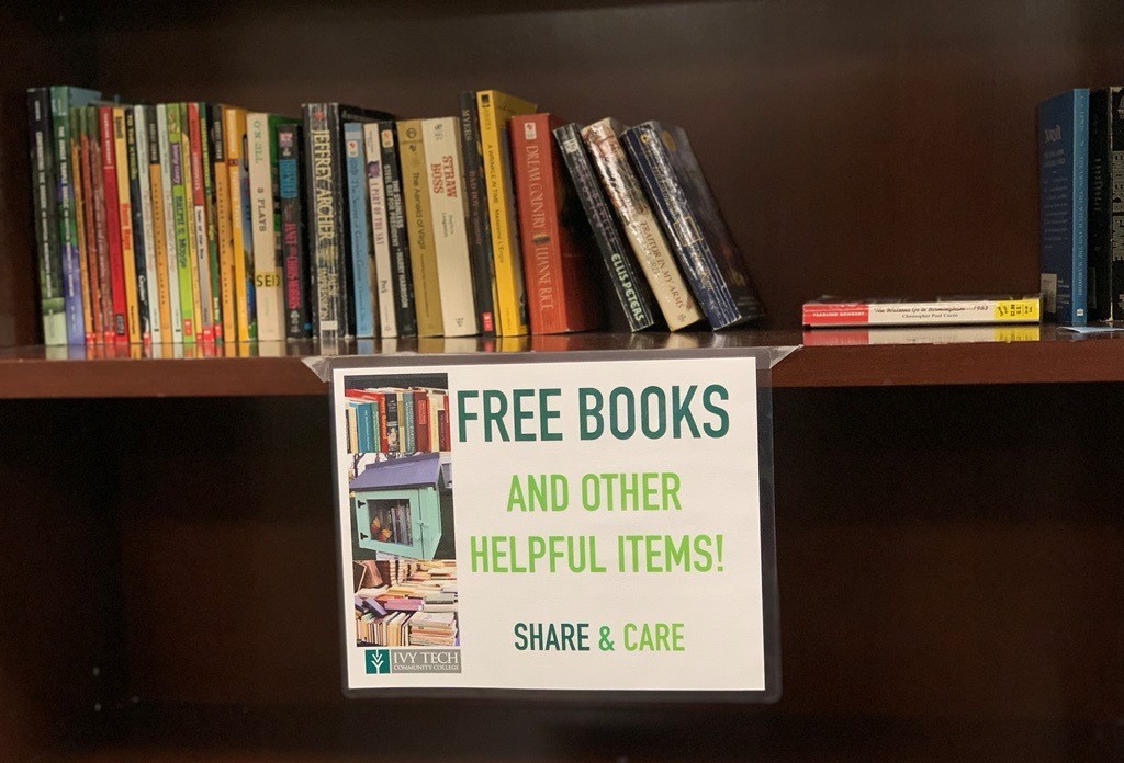 Professor stocks bookshelf with free books for Ivy Tech Indianapolis&nbsp;students